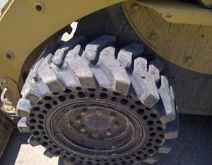 Nu-Air DT tire on CAT 226B_1 Nu-Air DT tire on CAT 226B_1