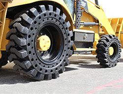 Shock absorbent tires improve performance and safety, reduce bouncing mclaren solid cushion_tire _installed on caterpillar 420f