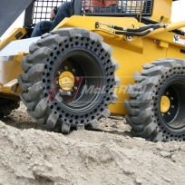 Solid Cushion tires for skid steer loaders John Deere 320 Solid Cushion tires for skid steer loaders John Deere 320