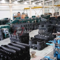 Rubber Tracks Manufacturing Facility - staging of harvester rubber tracks for Kubota Harvesters Rubber Tracks Manufacturing Facility - staging of harvester rubber tracks for Kubota Harvesters